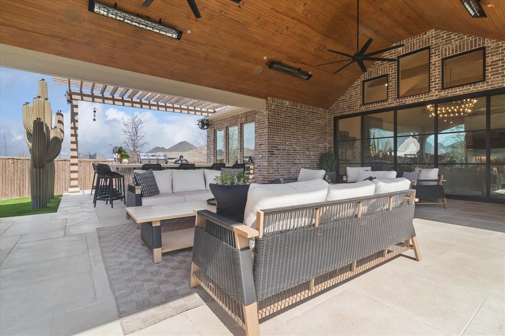 582 Broadleaf Way Haslet, TX 76052 - Photo 30 of 38 a living room with furniture a fireplace and a table