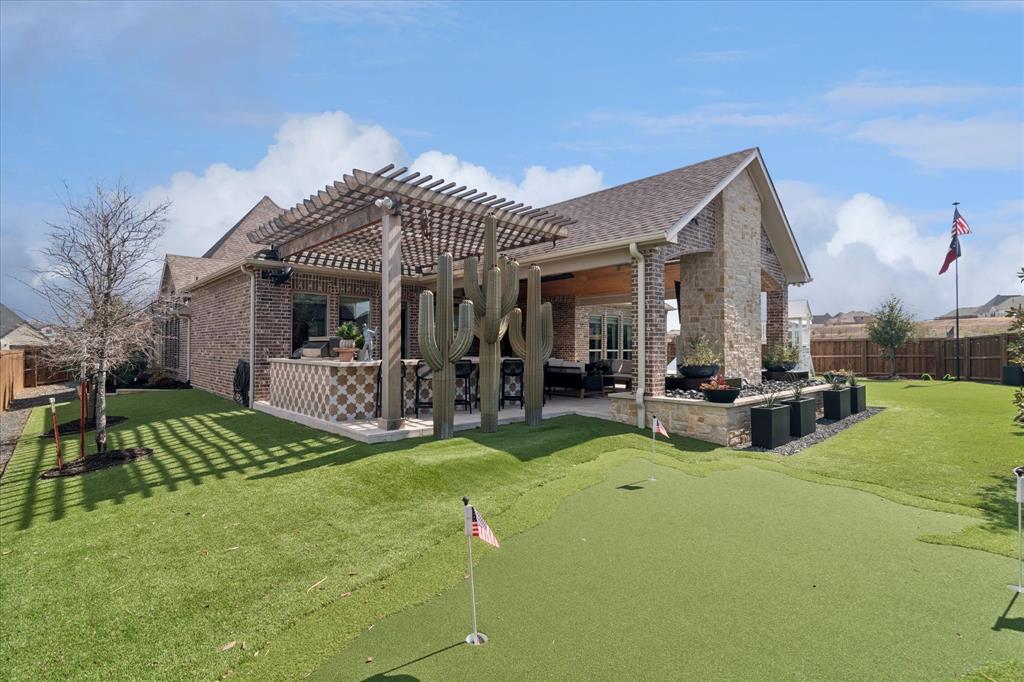 582 Broadleaf Way Haslet, TX 76052 - Photo 33 of 38 a view of a house with patio and a yard
