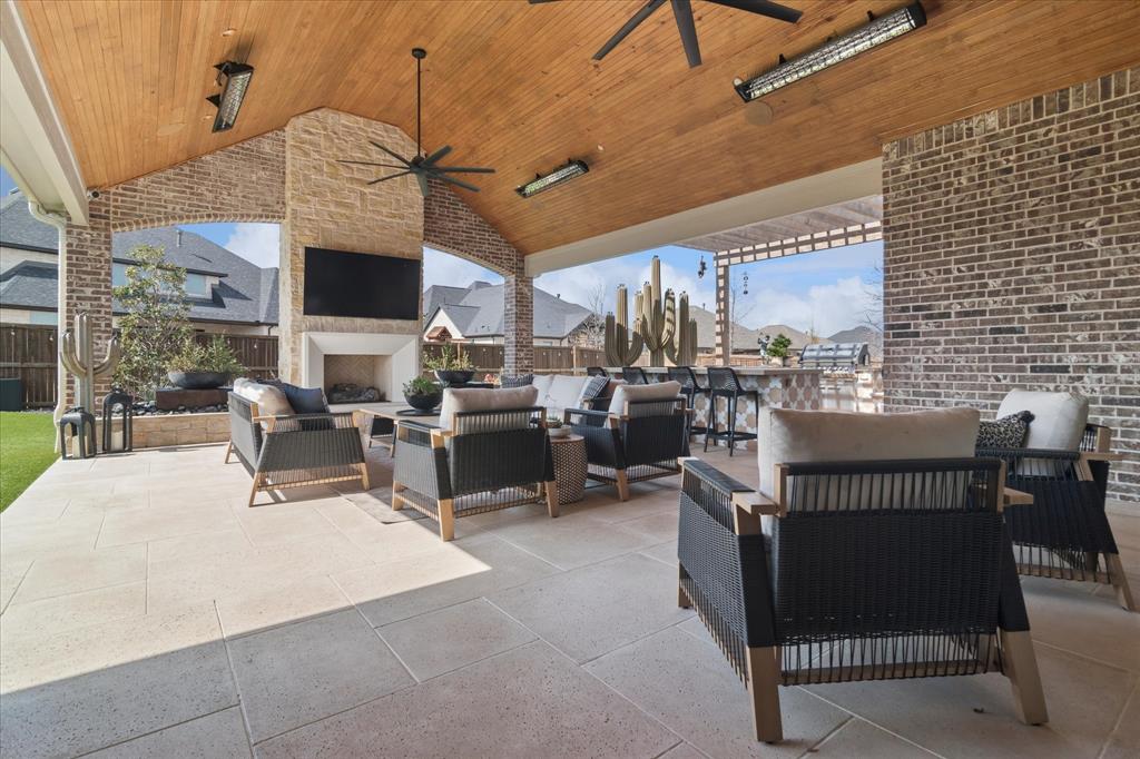 582 Broadleaf Way Haslet, TX 76052 - Photo 4 of 38 a view of a patio with dining table and chairs