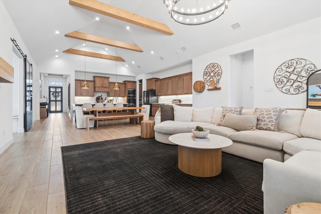582 Broadleaf Way Haslet, TX 76052 - Photo 7 of 38 a living room with furniture and a wooden floor