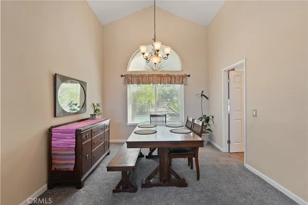 a open kitchen with stainless steel appliances granite countertop a stove and a refrigerator