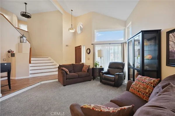 a kitchen with a table chairs a sink dishwasher window and cabinets