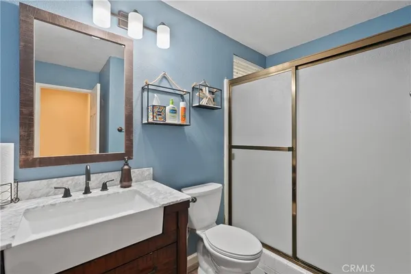 a spacious bathroom with a tub a double vanity sink and mirror