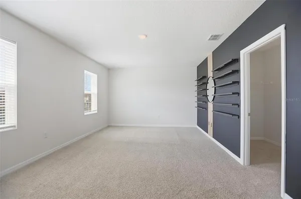 a bathroom with a double vanity sink and mirror with shower