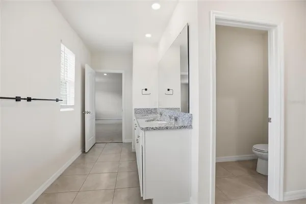 a view of an empty room and a window