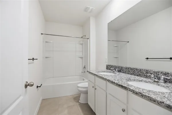 an empty room with a empty space and windows