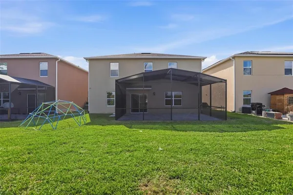 a view of a house with a back yard