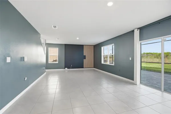 a kitchen with stainless steel appliances granite countertop a stove a microwave and a refrigerator