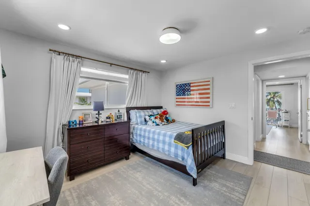 a bedroom with a bed and a walk in closet