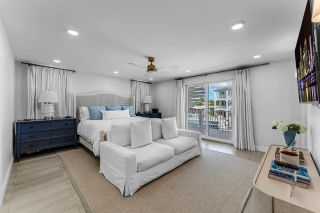 a bed room with a bed and a chandelier