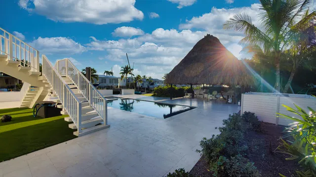 a view of a chairs and tables in the patio