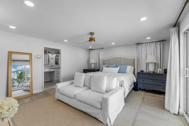 a bathroom with a granite countertop sink a mirror and a shower