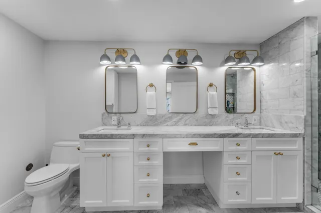 a bathroom with a shower and a sink