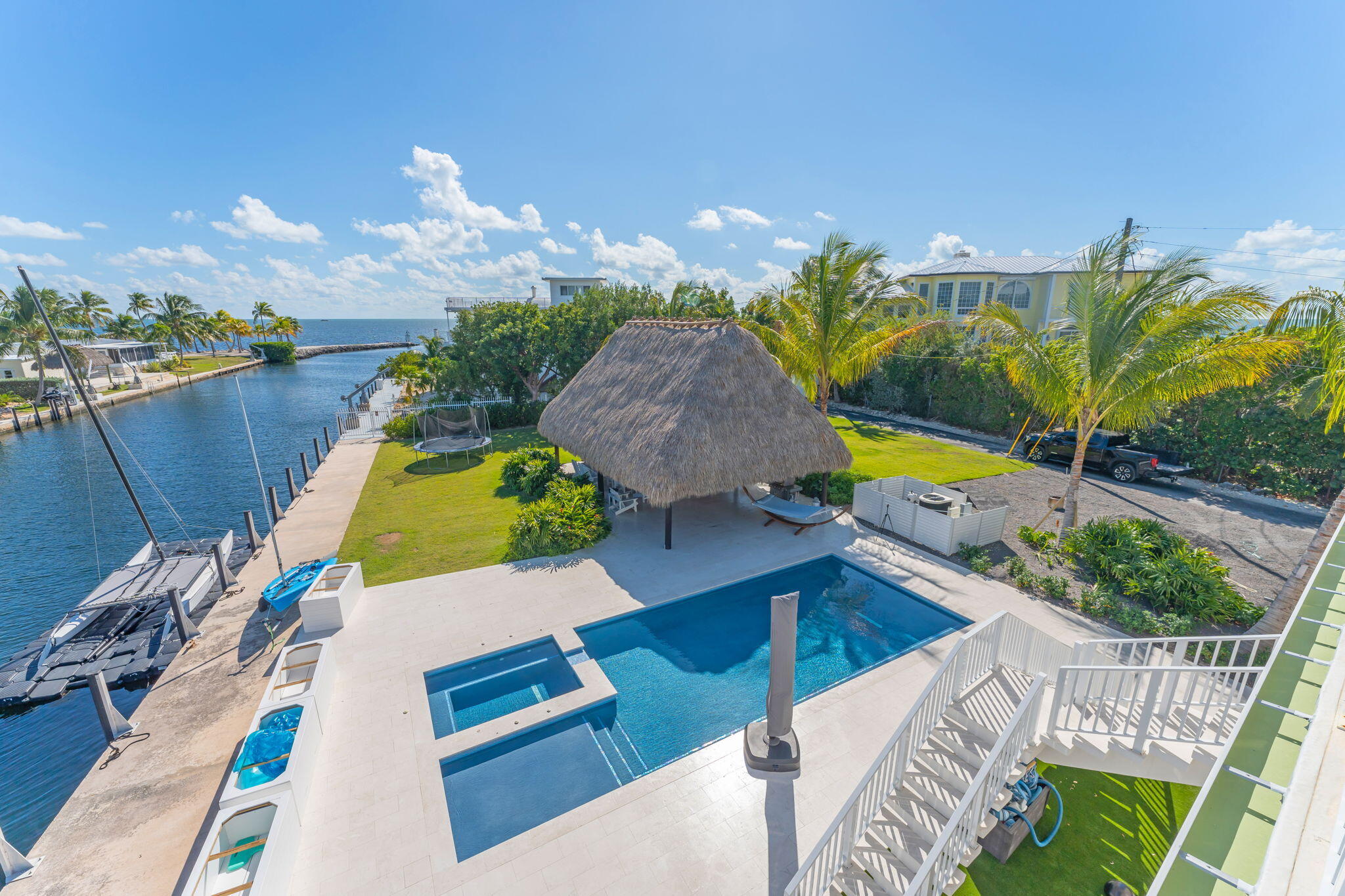 17 Poisonwood Road Key Largo, FL 33037 - Photo 31 of 57 a view of a swimming pool with a patio