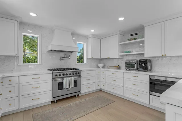 a kitchen with a sink stainless steel appliances and cabinets