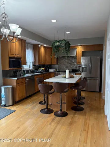 a kitchen with a sink cabinets and dining table
