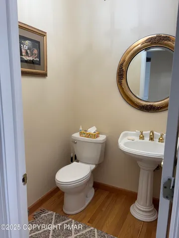 a bathroom with a toilet and a sink
