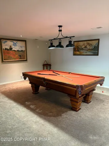 a room with furniture and wall paintings