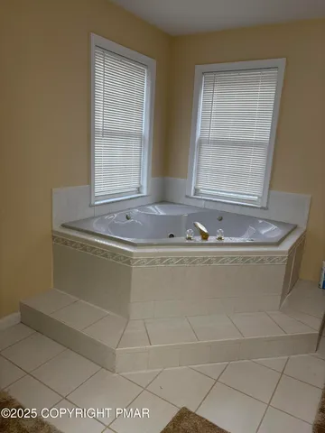 a white bath tub sitting in a bathroom