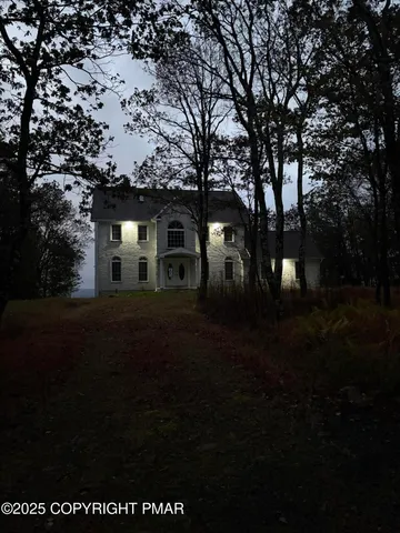 a view of house with yard