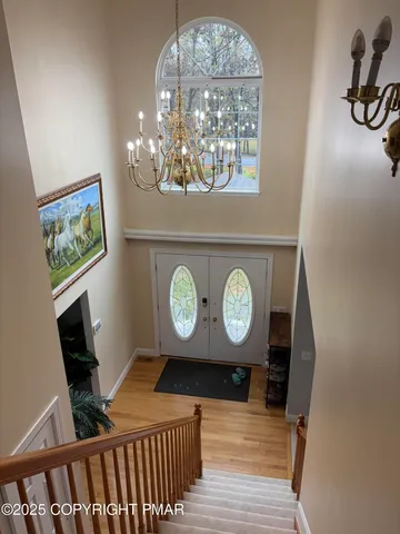 a view of a room with furniture and wooden floor