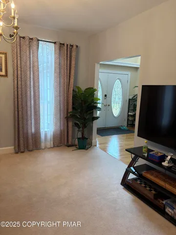 a room with furniture and a flat screen tv