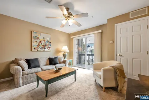 a living room with furniture a table and a window