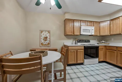 a kitchen with a sink cabinets and appliances
