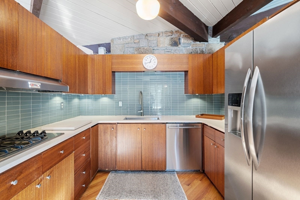 15 Westview Drive Sutton, MA 01590 - Photo 13 of 39 a kitchen with stainless steel appliances granite countertop a sink a stove and a refrigerator