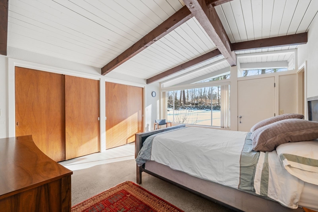 15 Westview Drive Sutton, MA 01590 - Photo 18 of 39 a bedroom with a bed and wooden floor