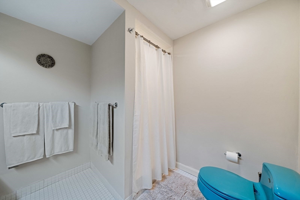 15 Westview Drive Sutton, MA 01590 - Photo 22 of 39 a bathroom with a sink a toilet and shower