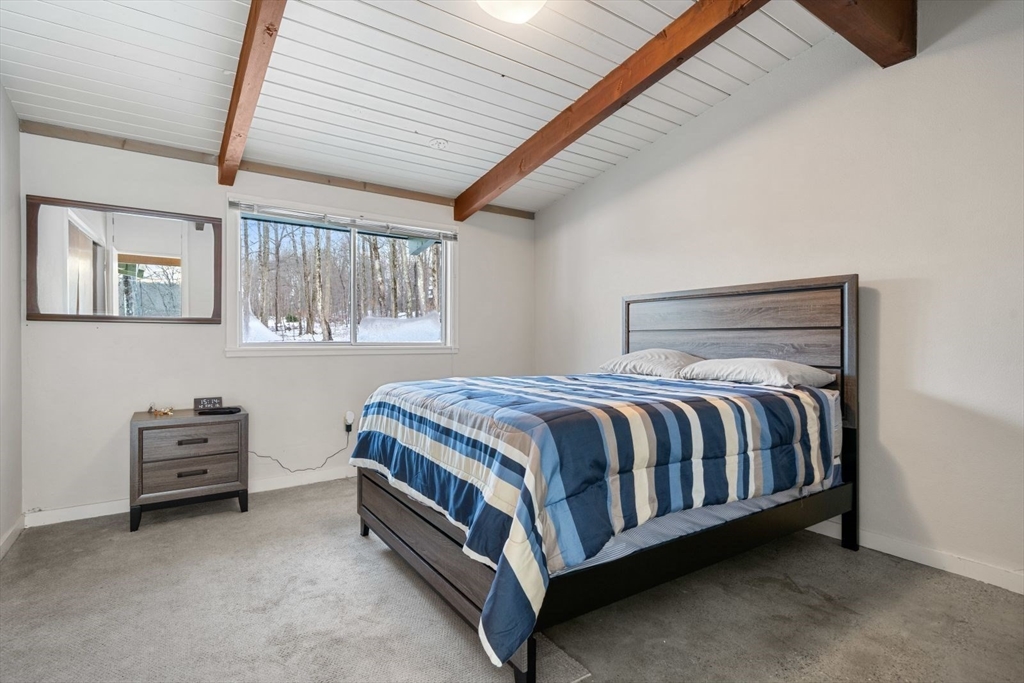 15 Westview Drive Sutton, MA 01590 - Photo 23 of 39 a bed sitting in a bedroom next to a window