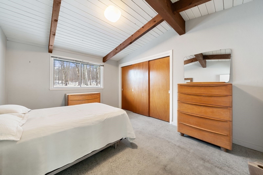 15 Westview Drive Sutton, MA 01590 - Photo 26 of 39 a bedroom with a bed and a dresser