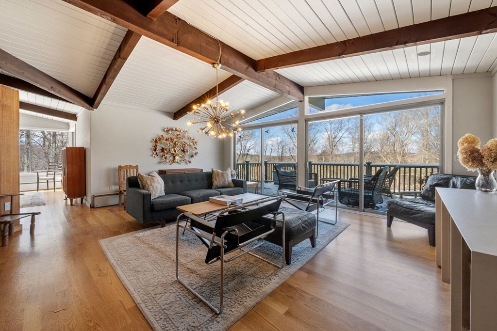15 Westview Drive Sutton, MA 01590 - Photo 4 of 39 a living room with furniture and a large window with wooden floor