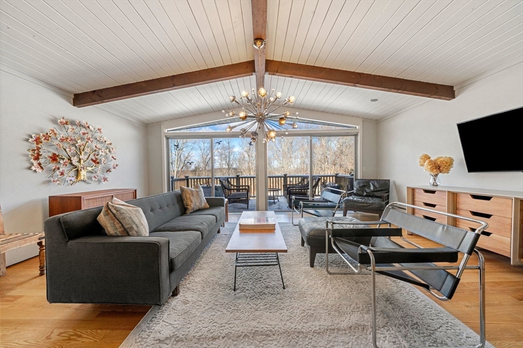 15 Westview Drive Sutton, MA 01590 - Photo 5 of 39 a living room with fireplace furniture and a chandelier