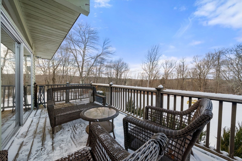 15 Westview Drive Sutton, MA 01590 - Photo 10 of 39 a view of balcony with wooden floor and outdoor seating