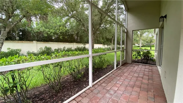 a view of a balcony with yard