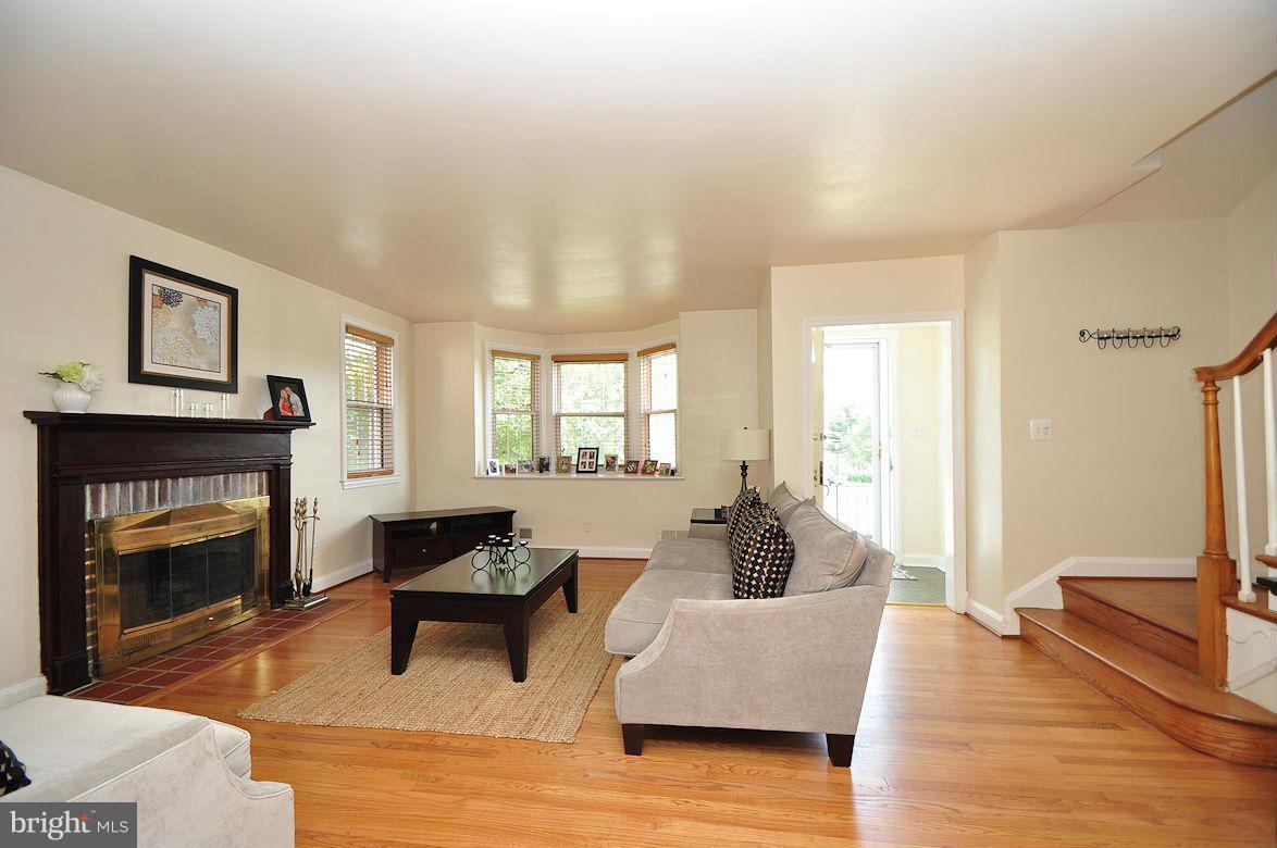 408 Greenlow Road Baltimore, MD 21228 - Photo 5 of 20 a living room with furniture and a fireplace