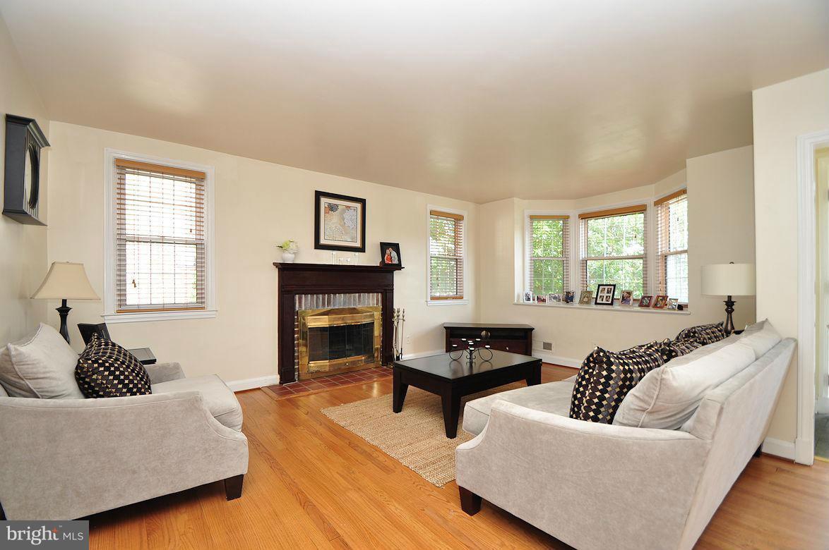 408 Greenlow Road Baltimore, MD 21228 - Photo 6 of 20 a living room with furniture and a fireplace