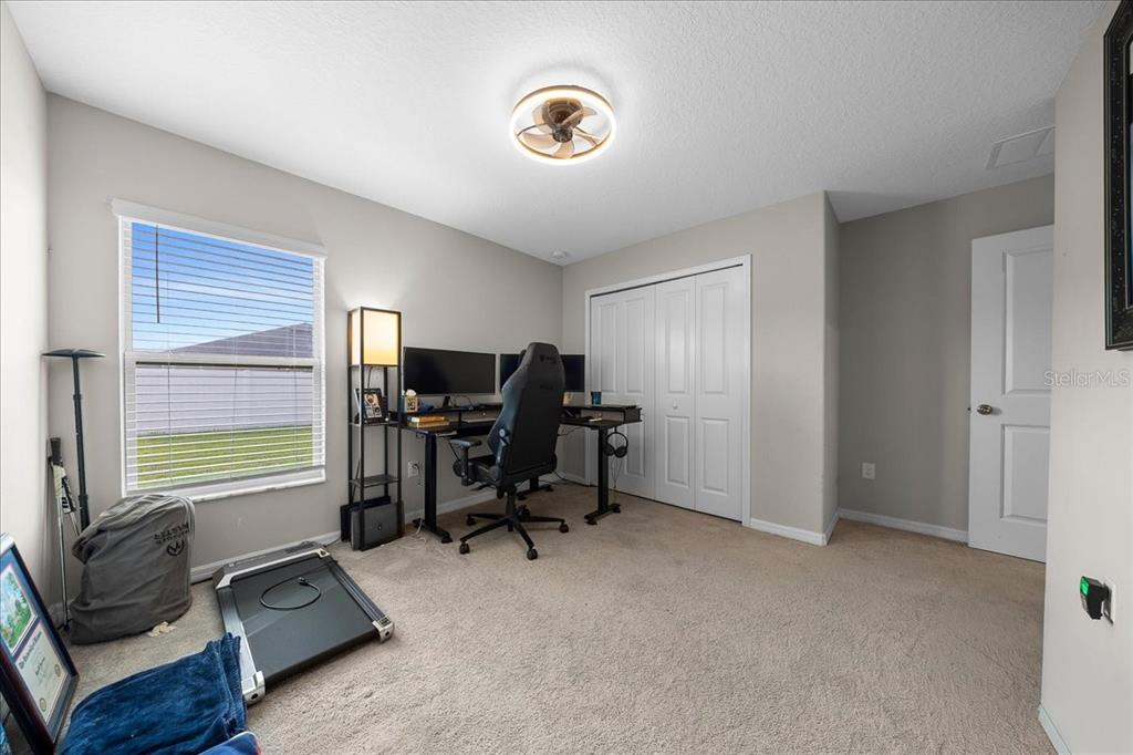 9329 Southwest 57th Terrace Ocala, FL 34476 - Photo 37 of 64 a view of a workspace with furniture and a window