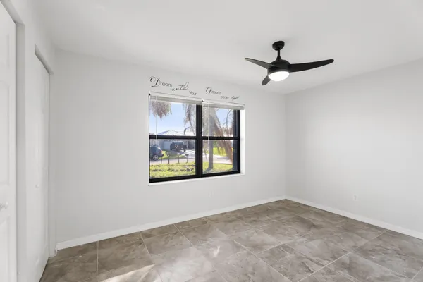 a kitchen with a refrigerator a stove and a sink