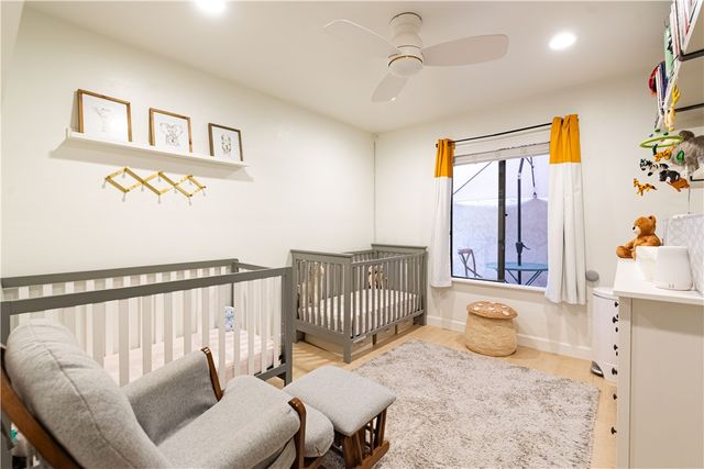 a bedroom with furniture and a window