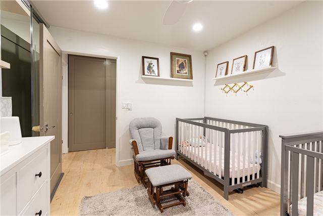 a bedroom with furniture and a window