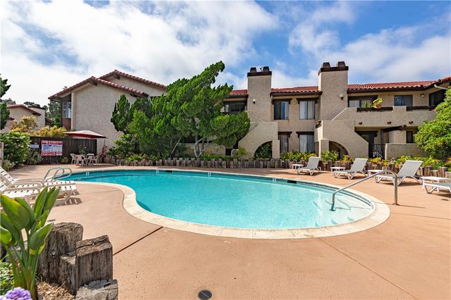 a view of a swimming pool with a patio