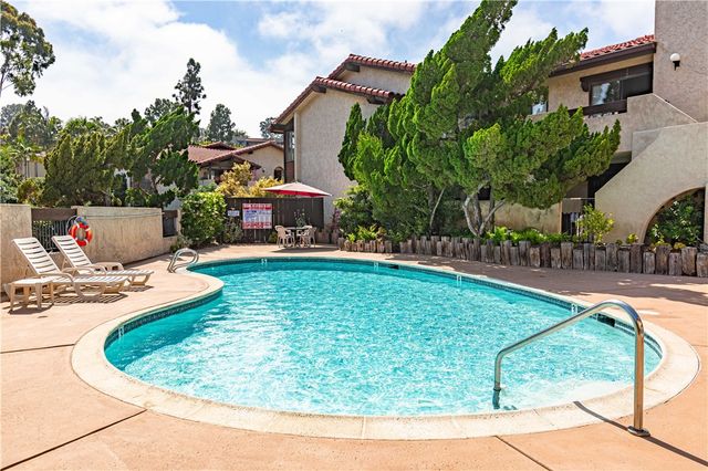 a view of a swimming pool with a patio