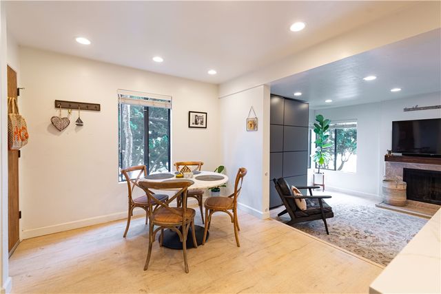 a view of a livingroom with furniture and a flat screen tv