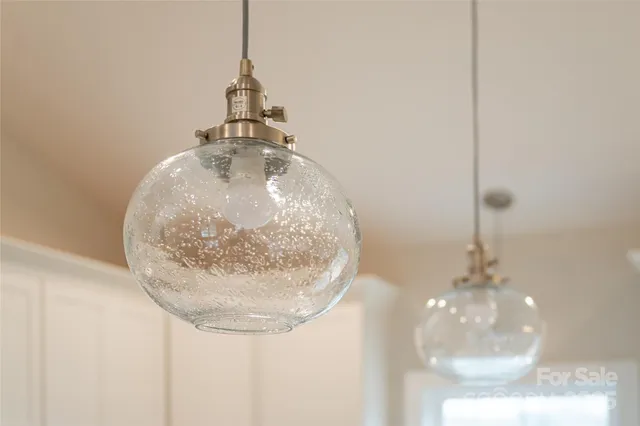 a kitchen with stainless steel appliances granite countertop a sink stove and microwave