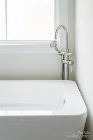 a bathroom with a double vanity sink and mirror