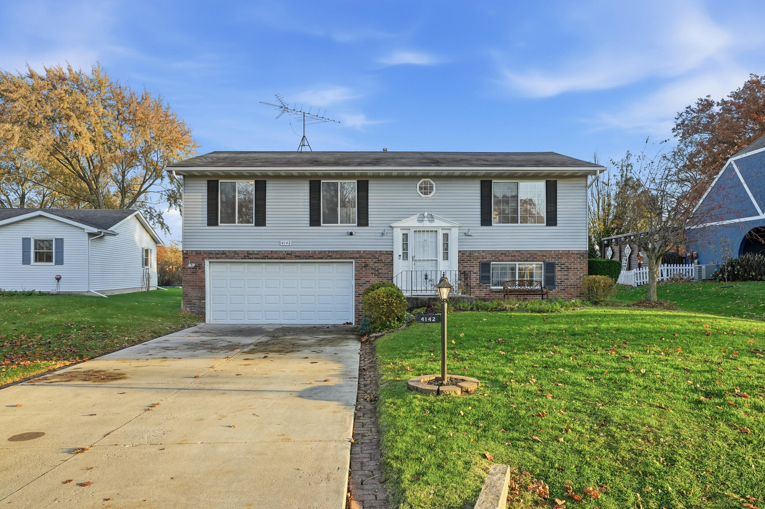 4142 Augusta Drive Crown Point, IN 46307 - Photo 2 of 24 a front view of house with yard and green space