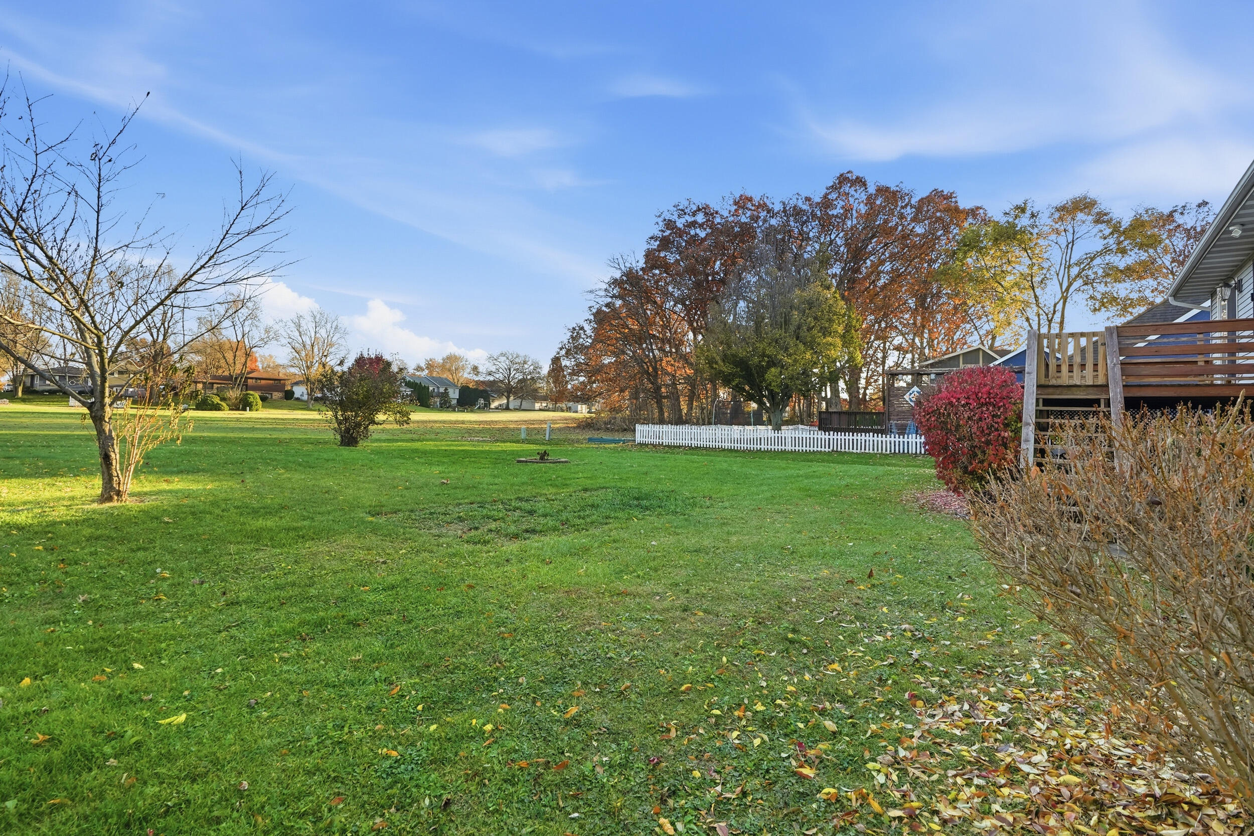 4142 Augusta Drive Crown Point, IN 46307 - Photo 24 of 24 a backyard of a house with lots of green space and lake view